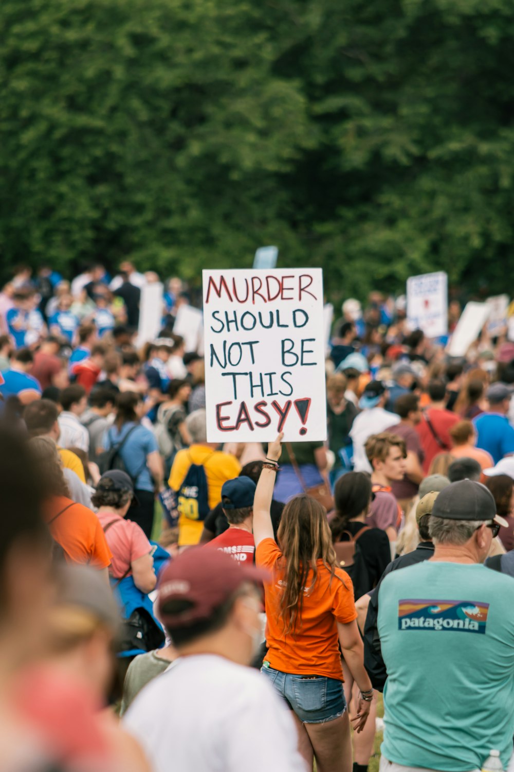 a crowd of people holding signs