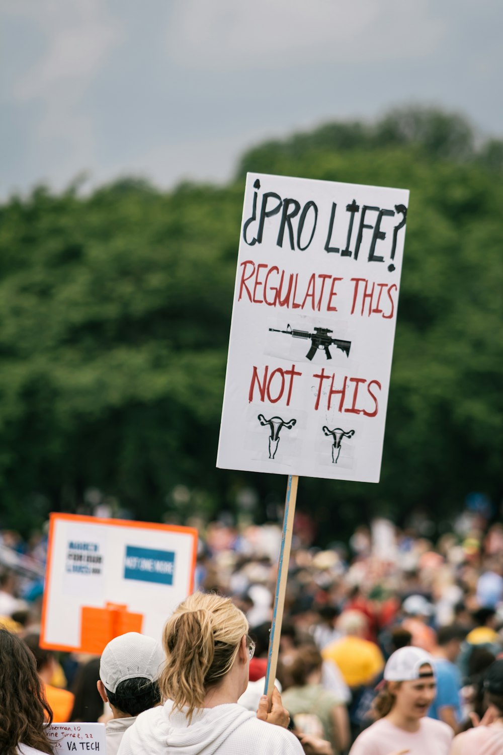 a group of people holding signs