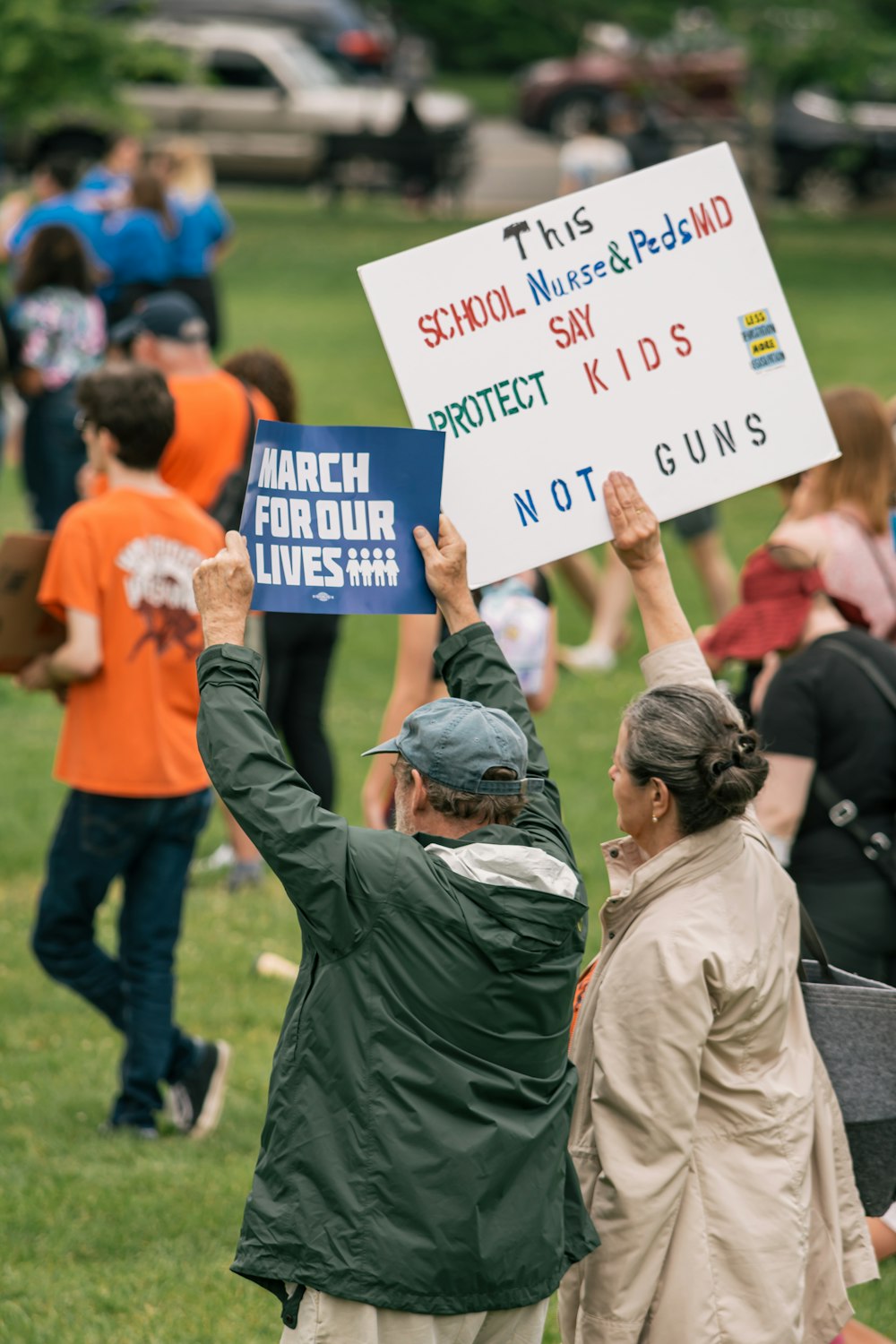 a group of people holding signs