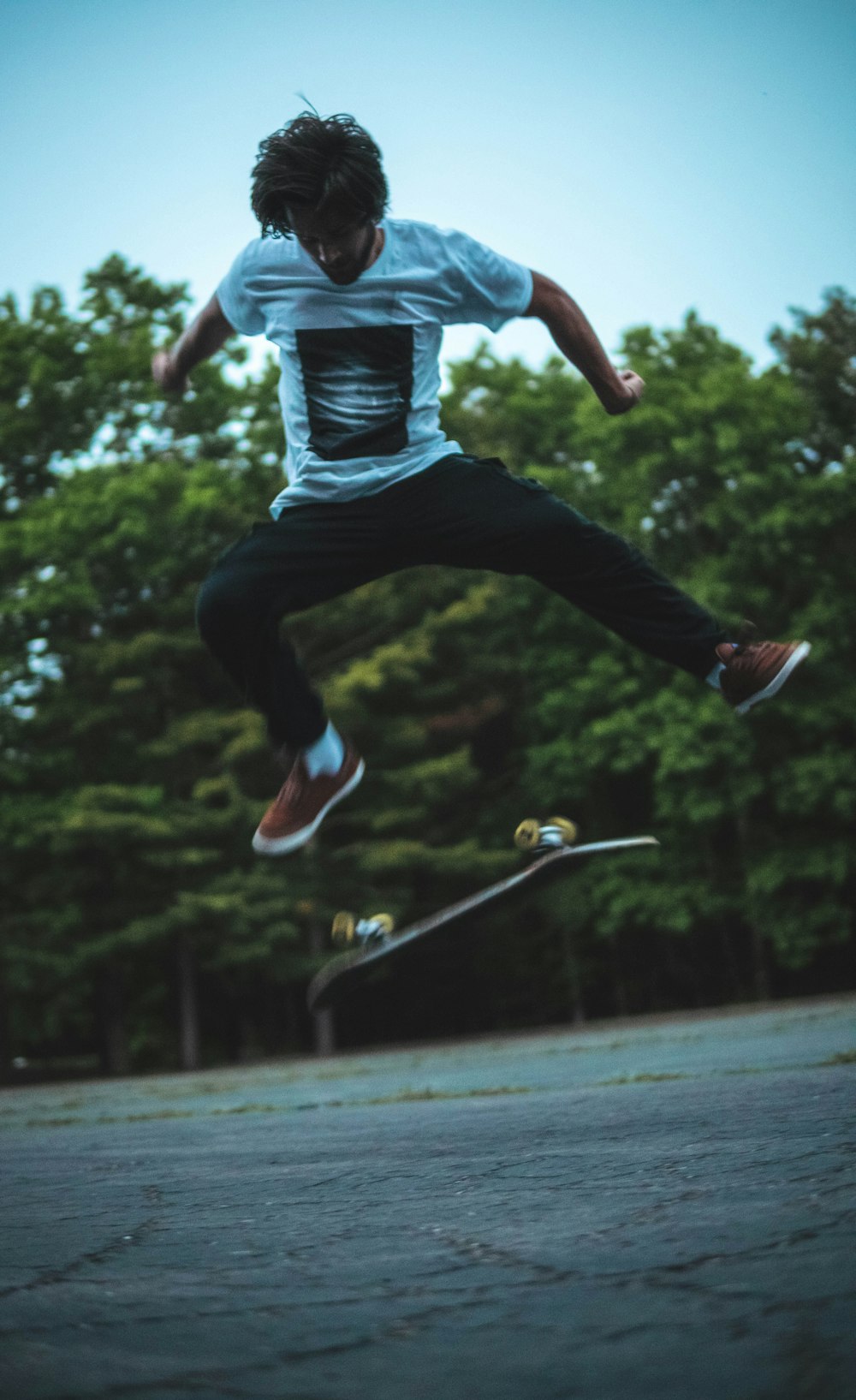 a man jumping in the air with a skateboard