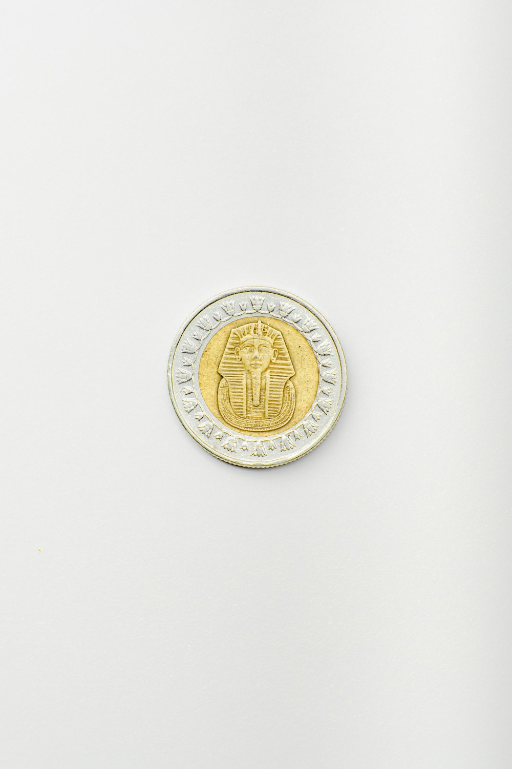 a coin with a gold design