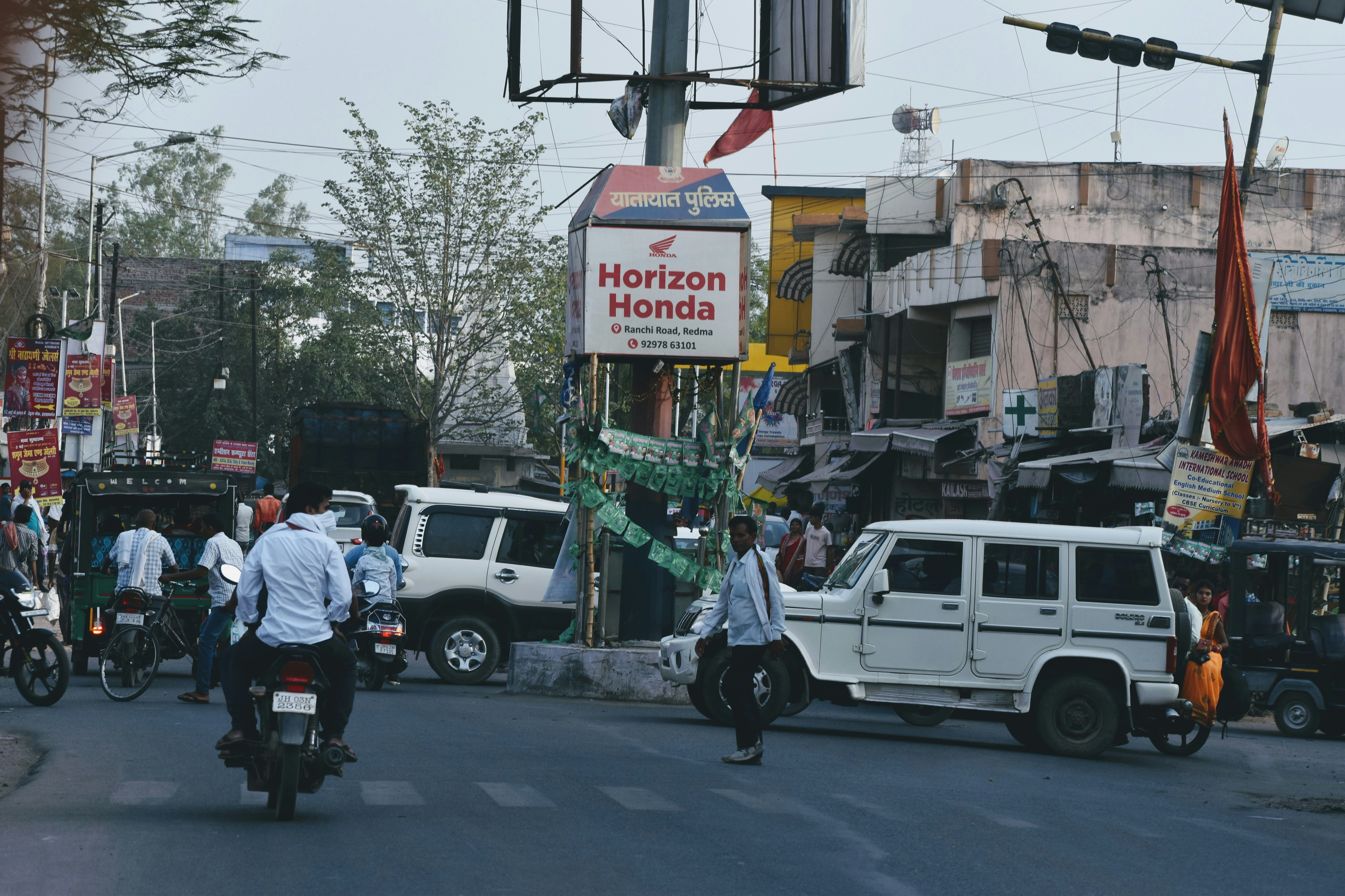 a busy street with people and vehicles