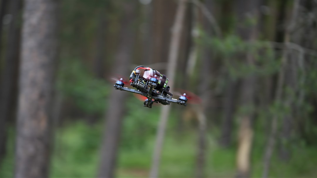 a person riding a drone,