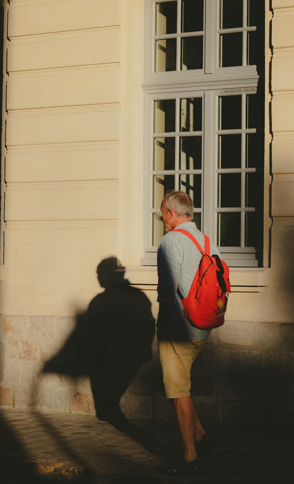 a person walking by a building