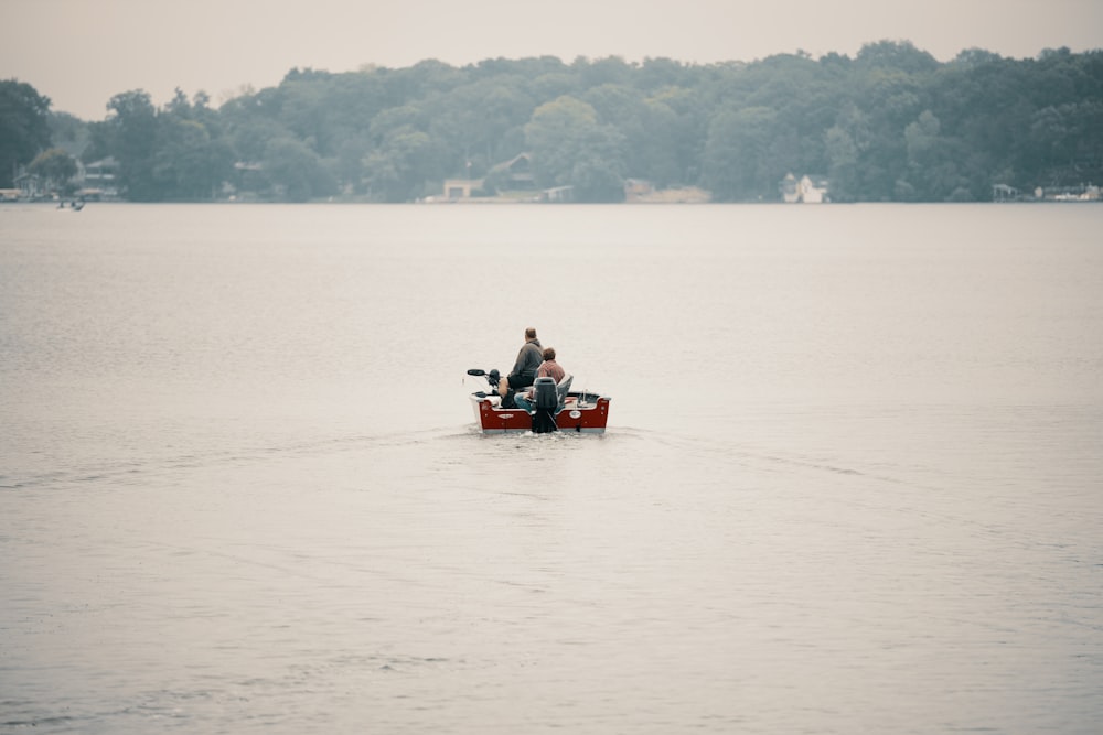 a couple of people on a boat in a body of water