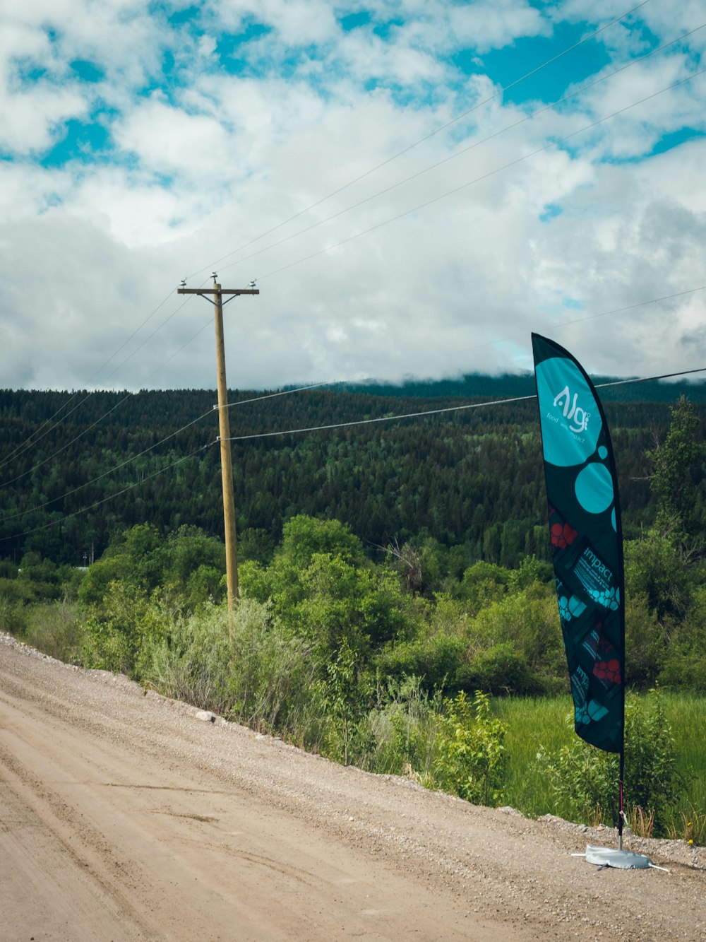 a flag on a dirt road