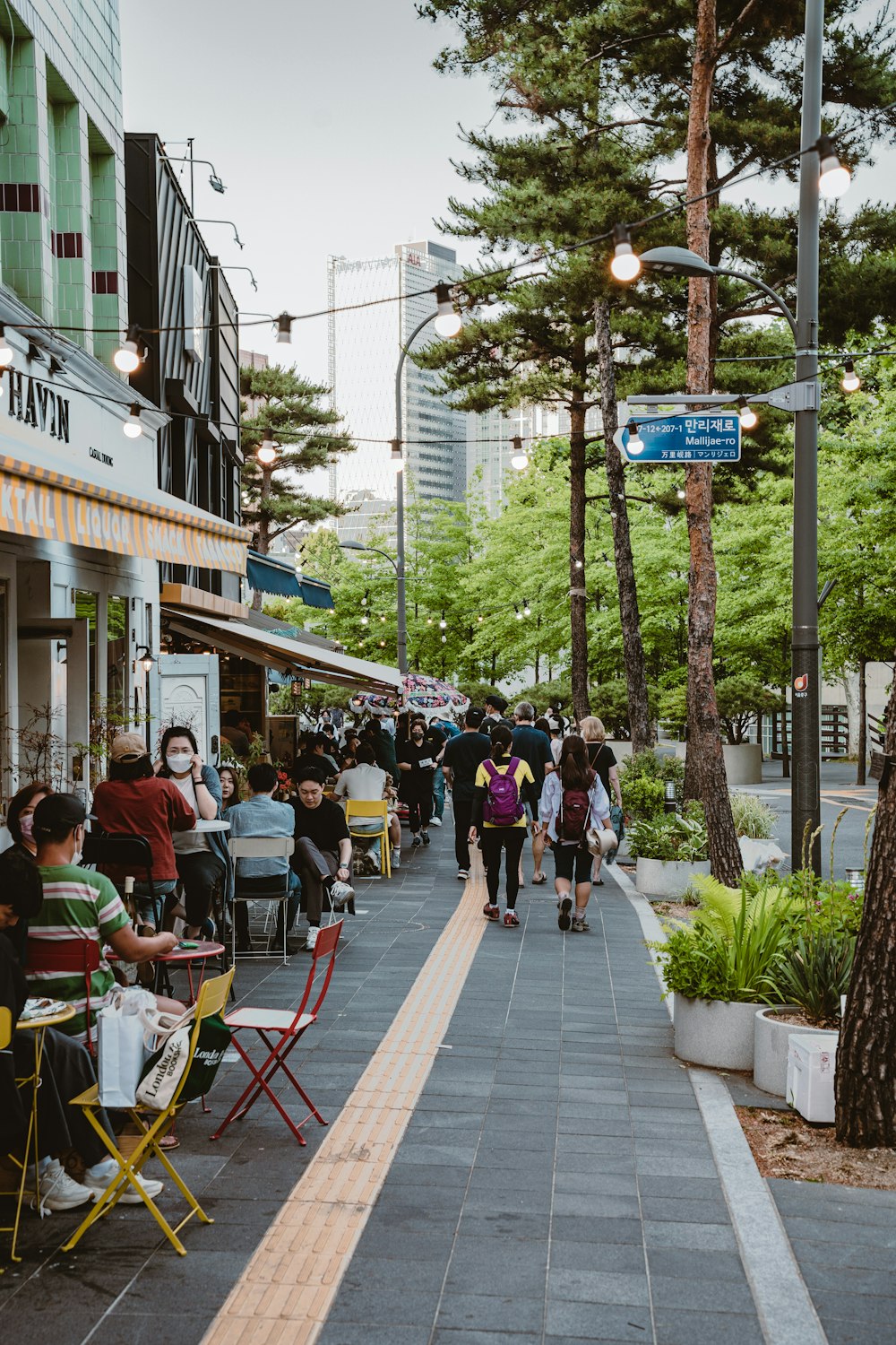 people walking on a sidewalk