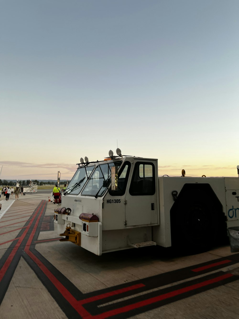 a white truck parked on a dock