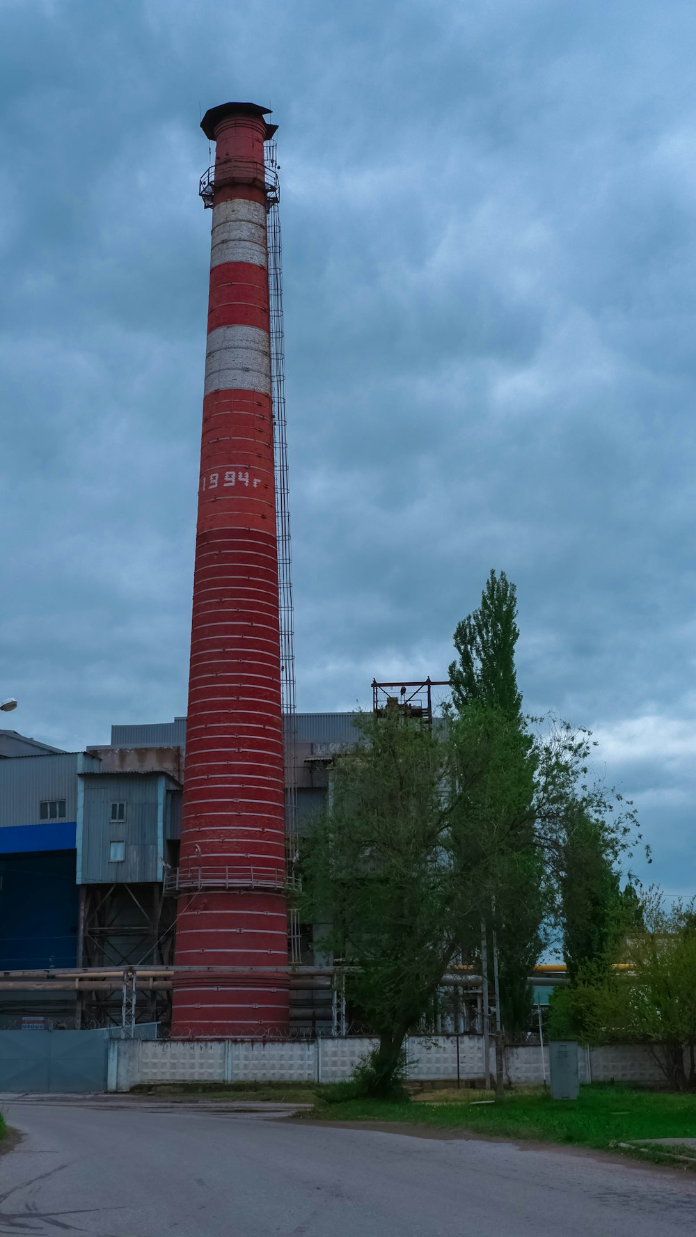 a tall red and white tower with Smeaton's Tower in the background