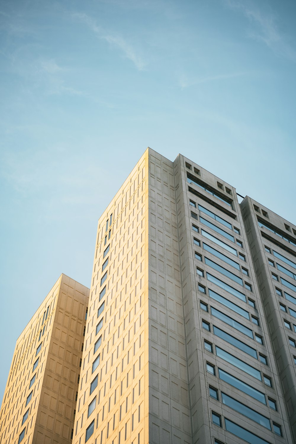 a tall building with a blue sky