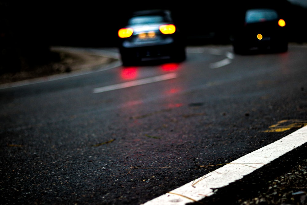 a group of police cars on a road at night