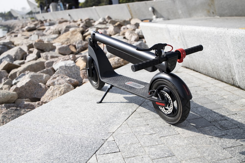 a small black and red bicycle