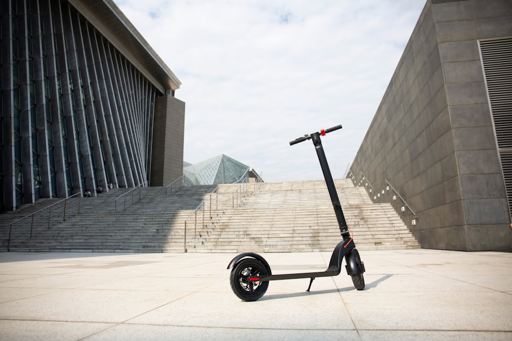 a scooter parked outside a building