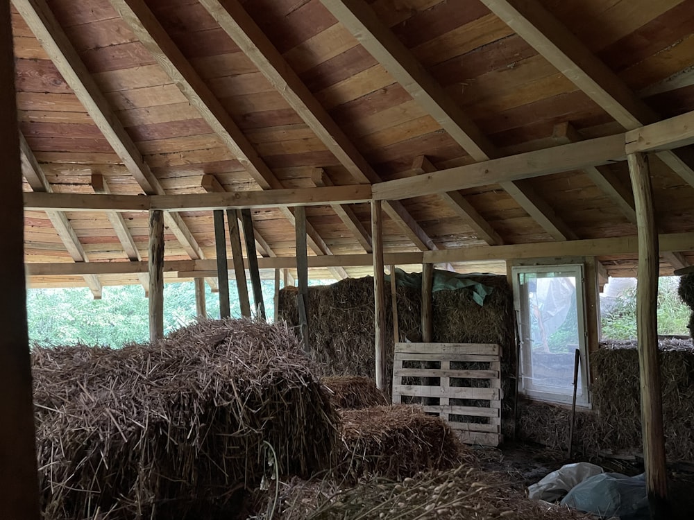 a group of straw bales in a barn