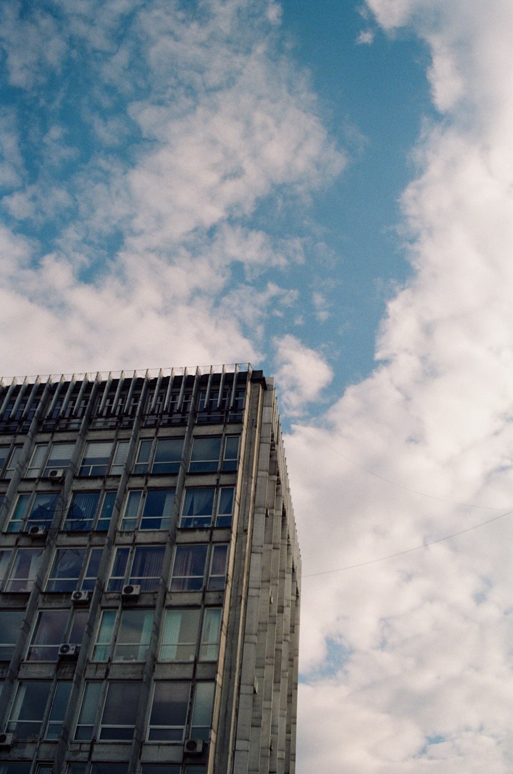 a tall building with a blue sky