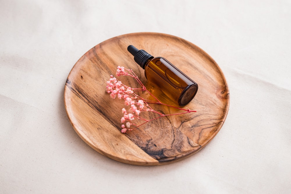 a bottle of alcohol on a wooden board