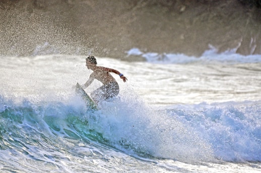 a man surfing on a wave