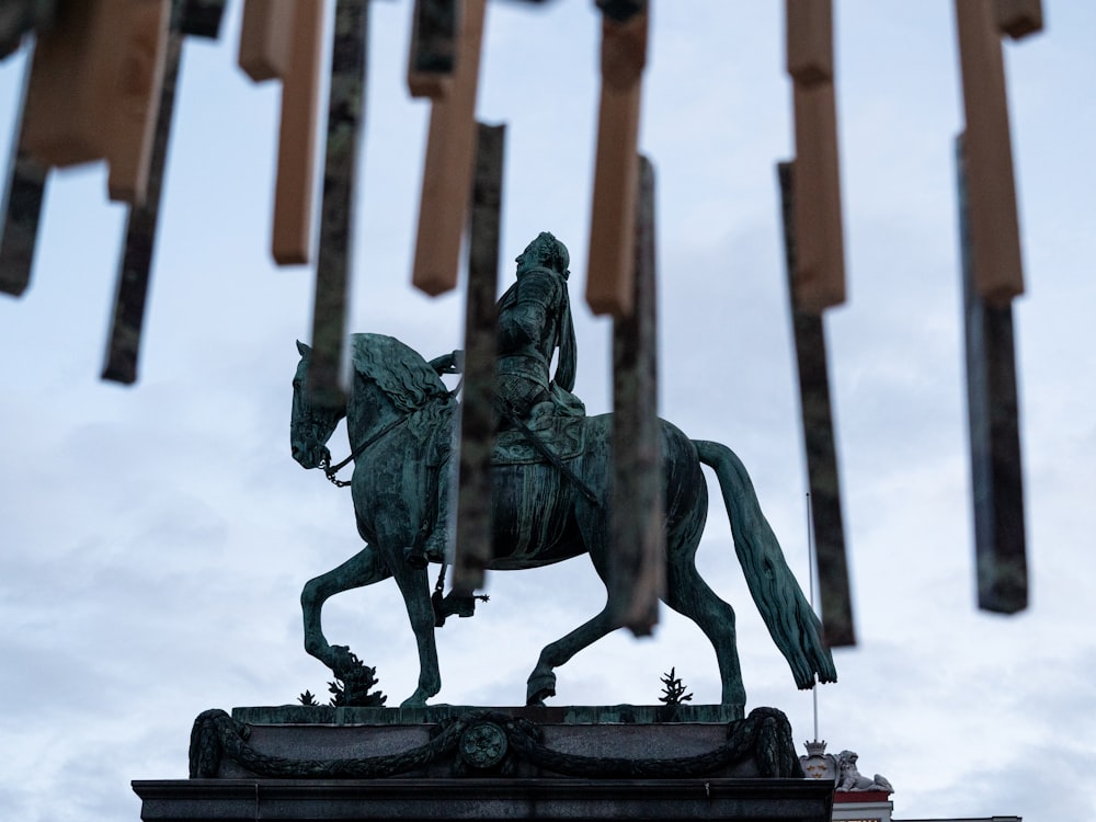 a statue of a person riding a horse