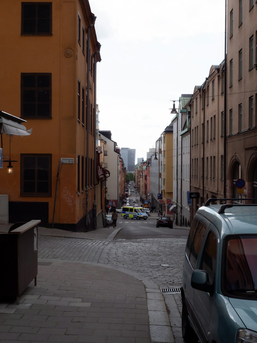 a street with cars and buildings on either side of it