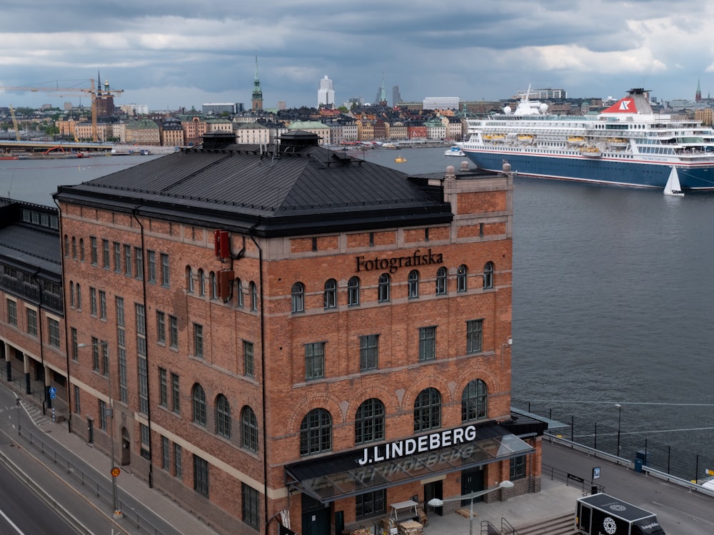 a building next to a body of water