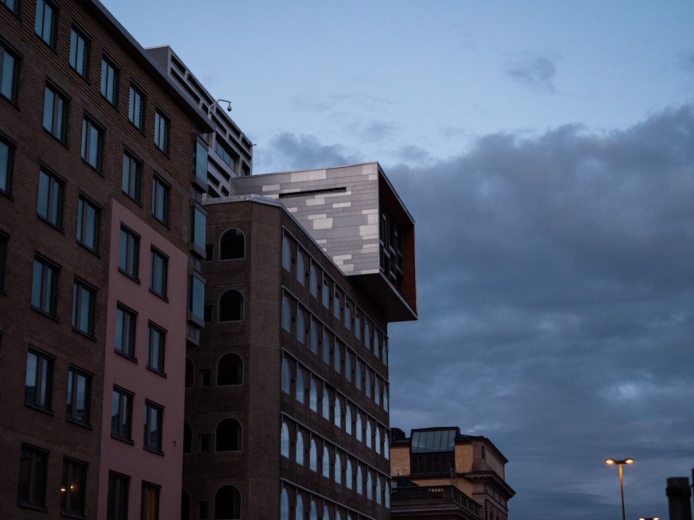 a tall building with a cloudy sky