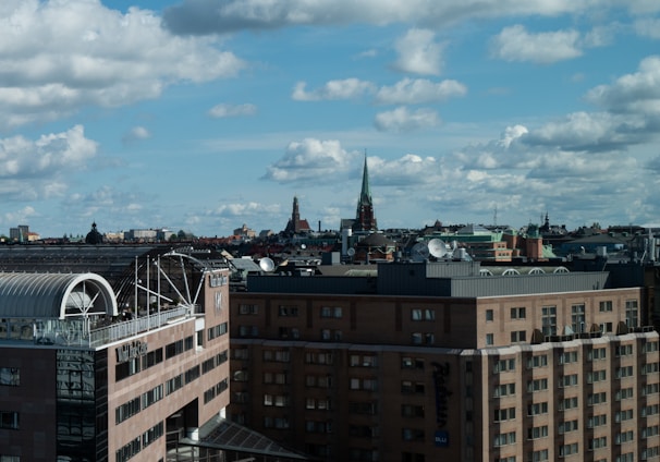 a group of buildings with a blue sky above