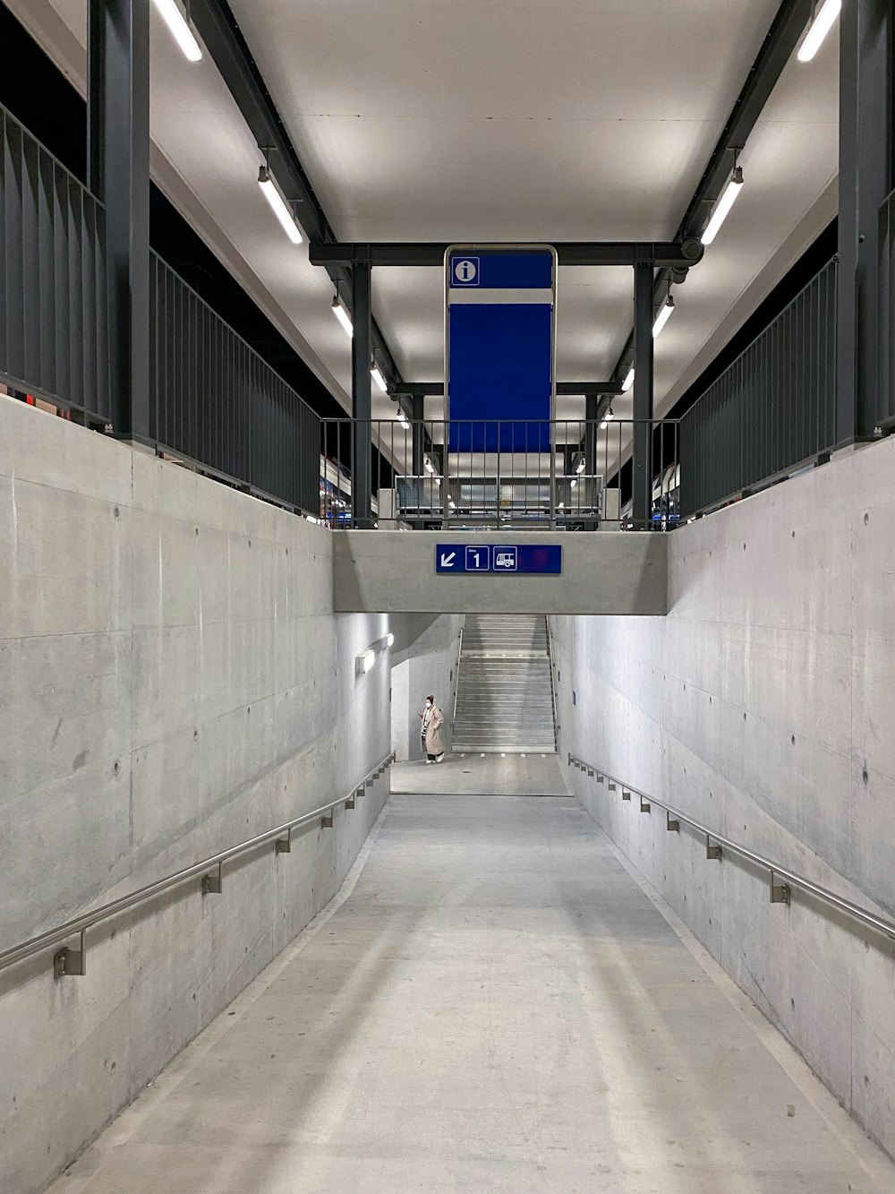 a person walking down a hall way