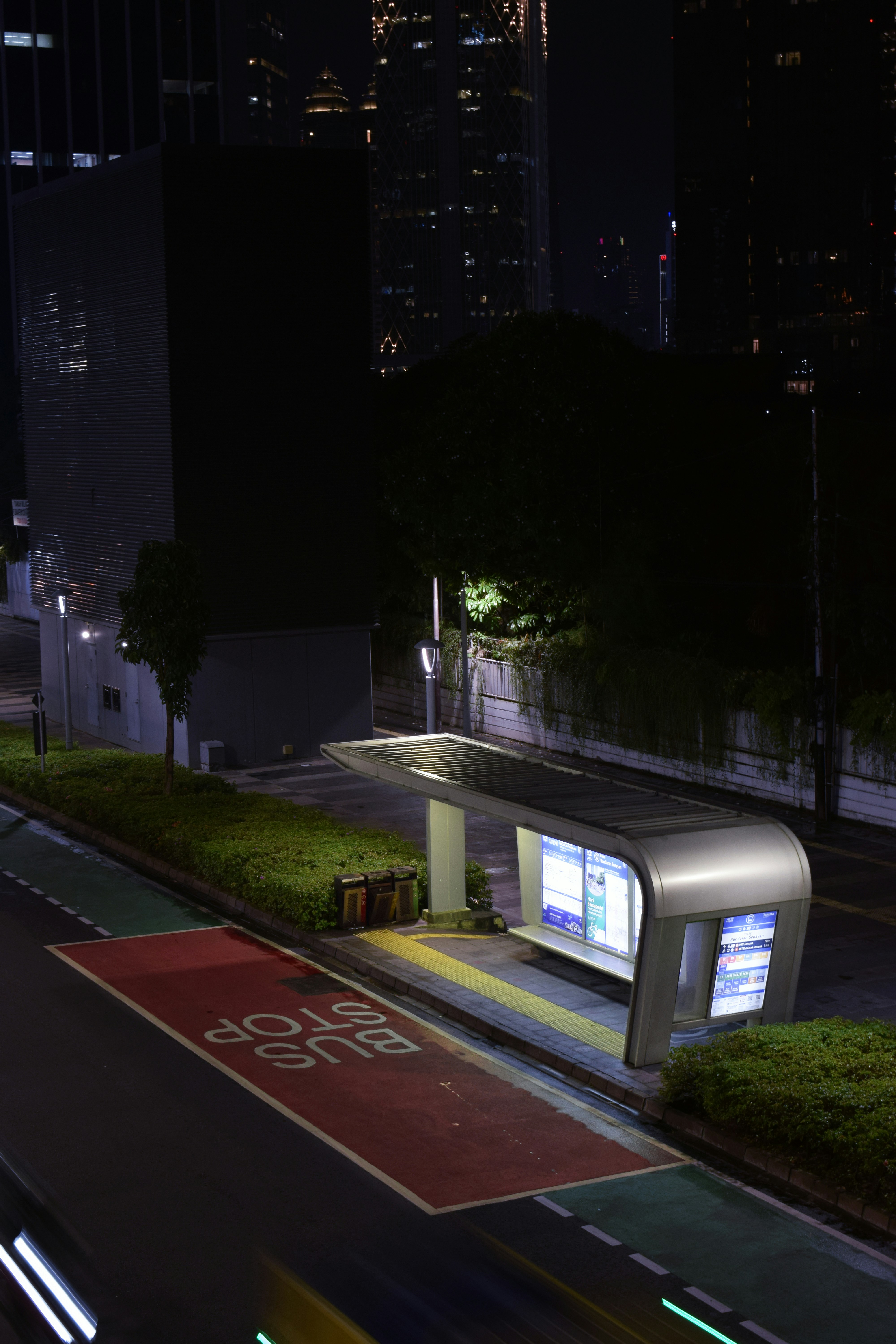 Modern bus at night, urban transportation, dramatic low key lighting