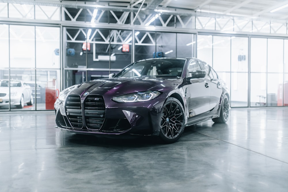 a black sports car in a showroom