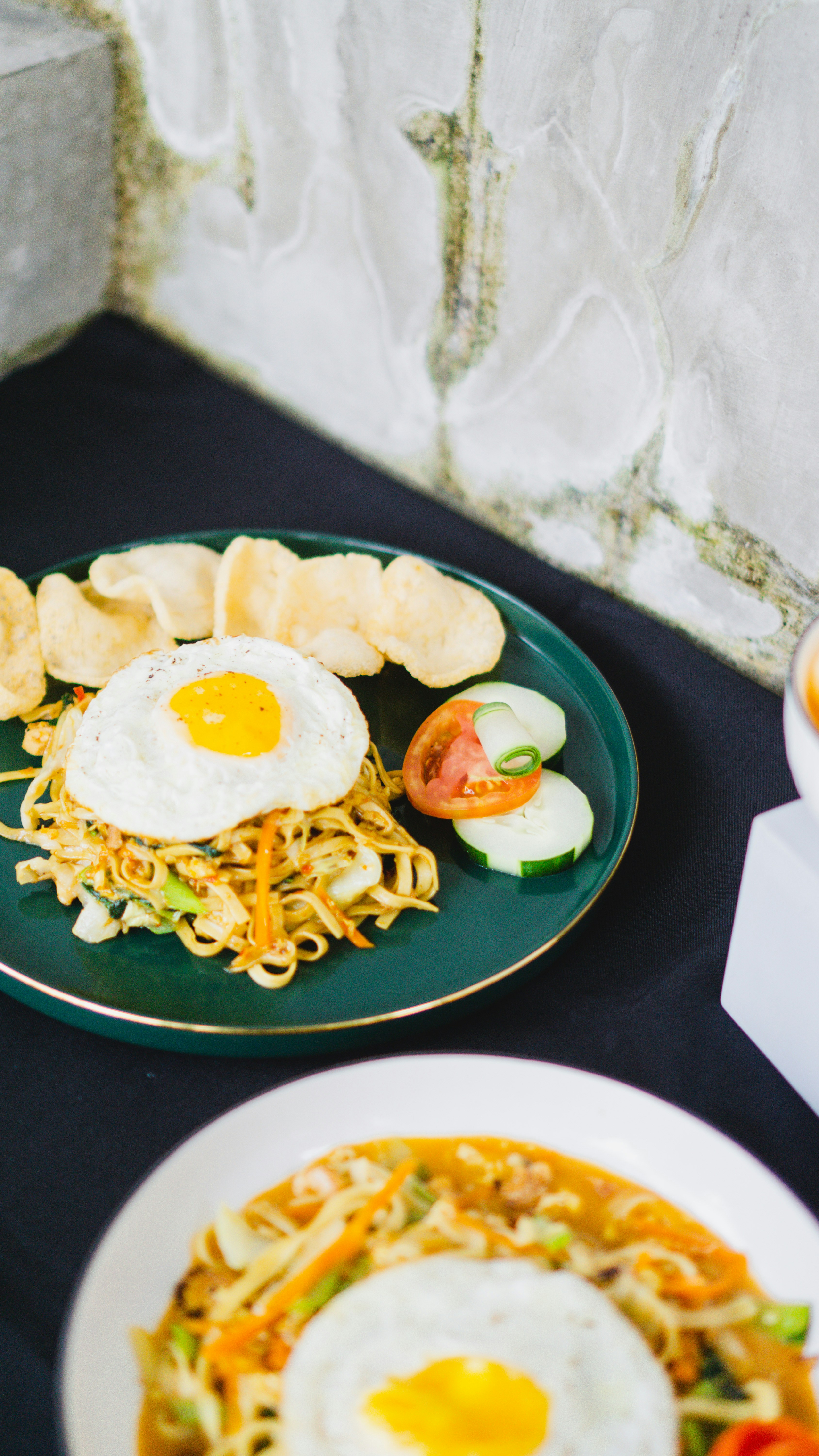 a couple of plates with food on them