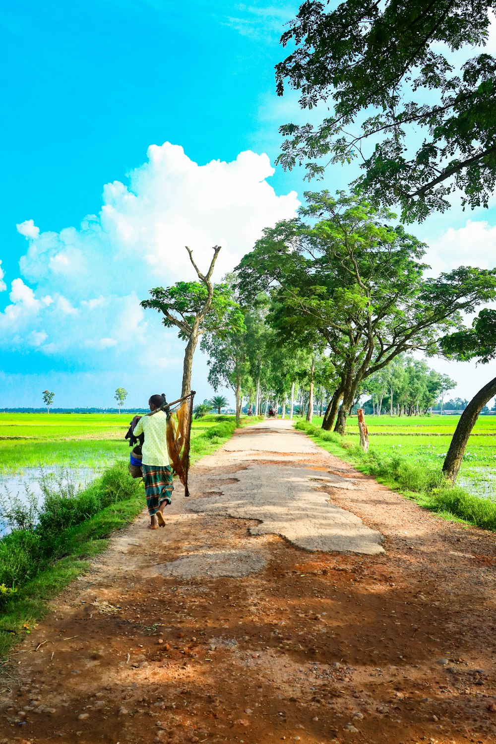 a person walking on a dirt path