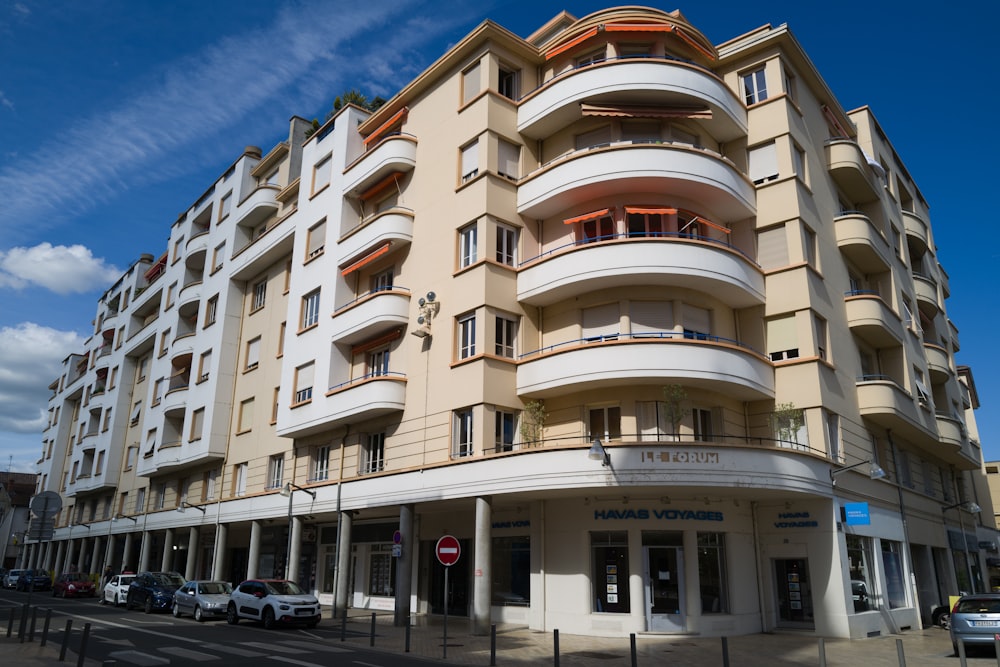 a building with cars parked in front