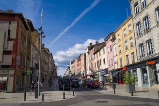 a street with cars and buildings on the side