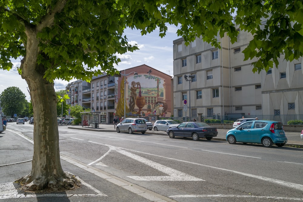 a street with cars and buildings on the side