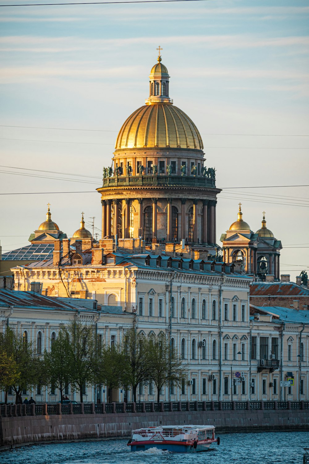 a boat in front of a large building