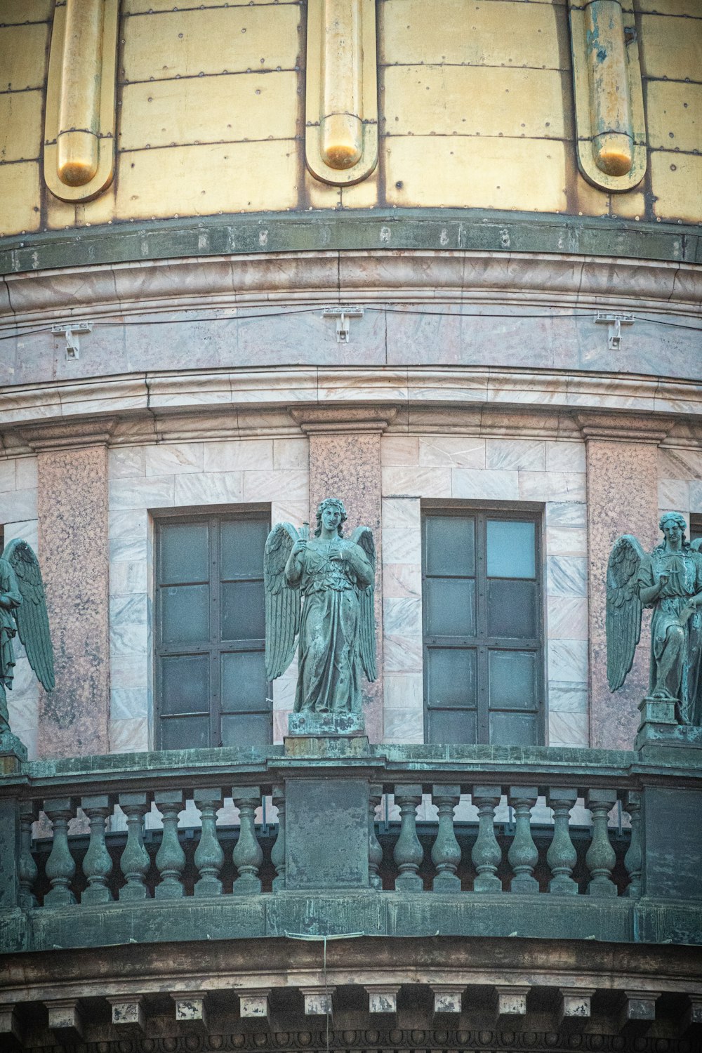 a building with statues on the windows