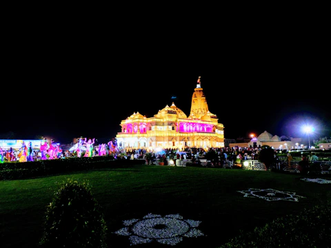 Volunteers decorating the temple area with colorful flowers and lights.