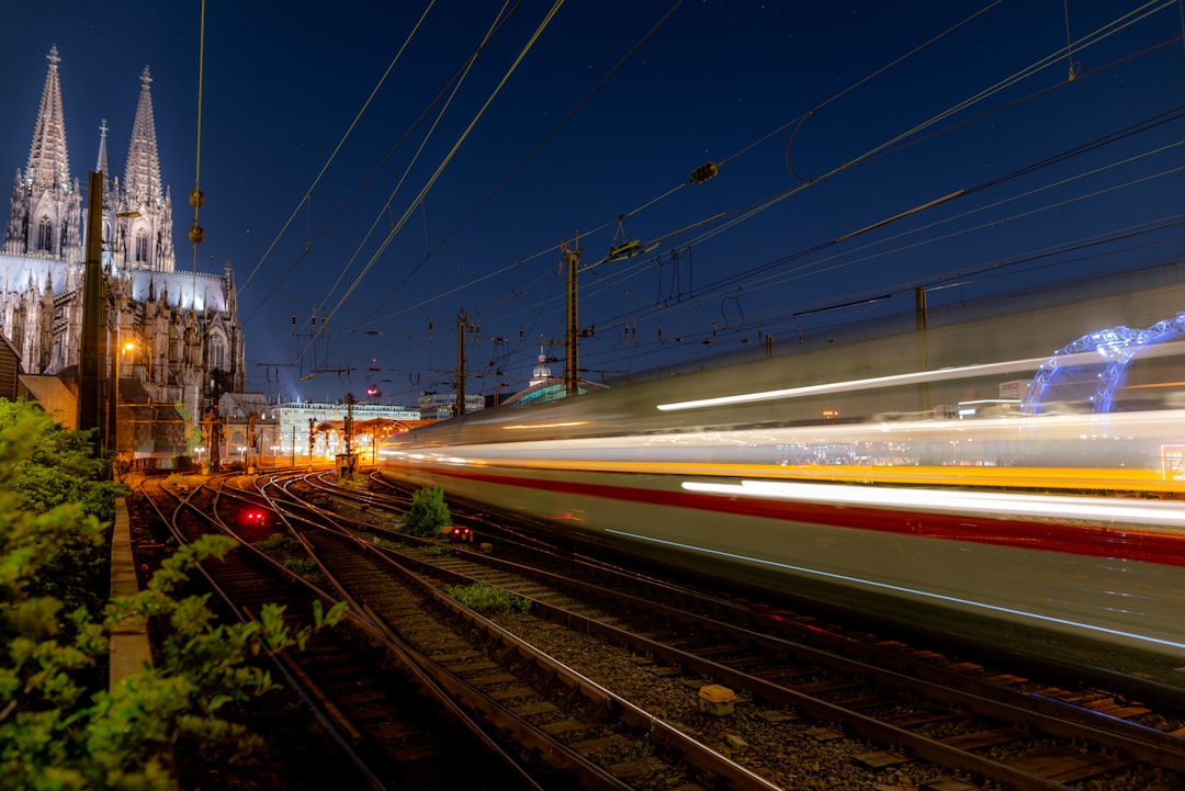 a train on the railway tracks, An ICE high speed train leaving the Cologne Central Station