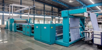 a large room with blue machines