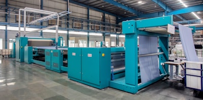 a large room with blue machines