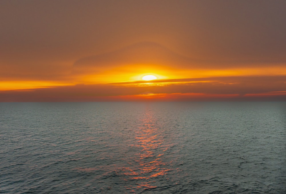 a sunset over a body of water