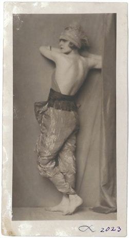 A sepia-toned portrait of Mark Sheridan in his iconic music hall costume from the early 1900s.