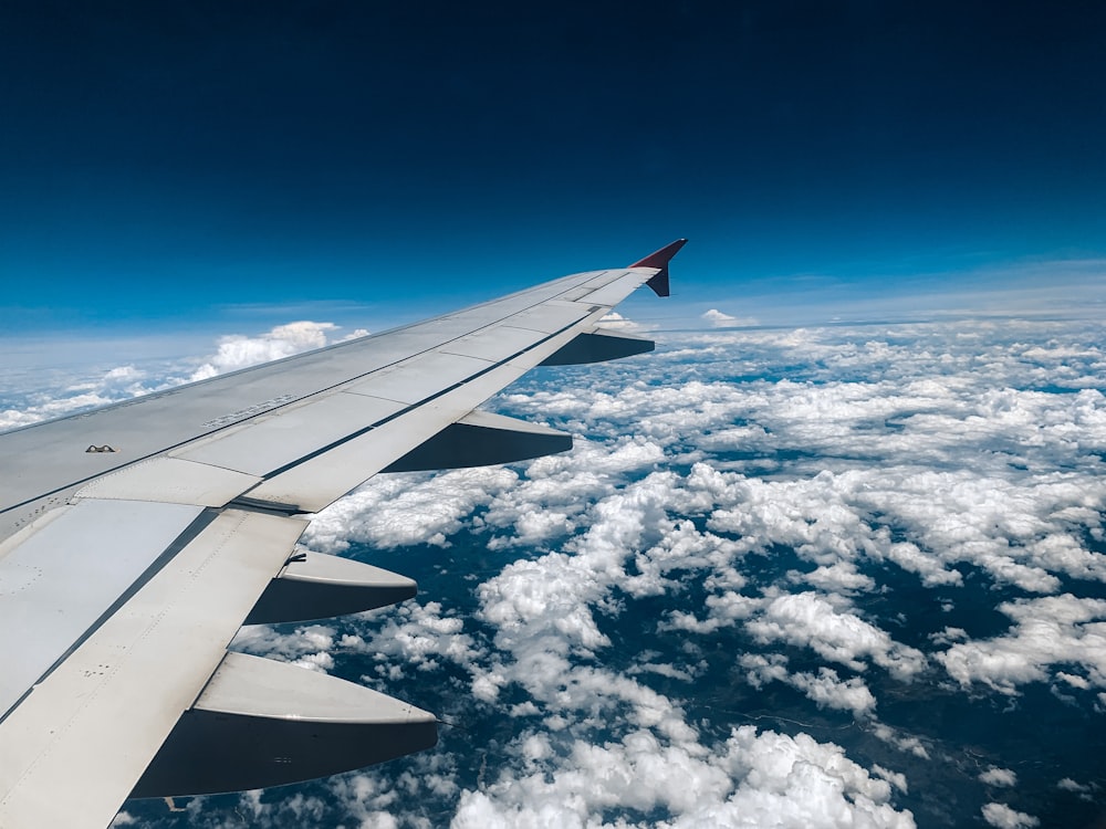 an airplane wing in the sky