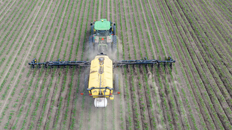 Agricultural machinery working a crop field