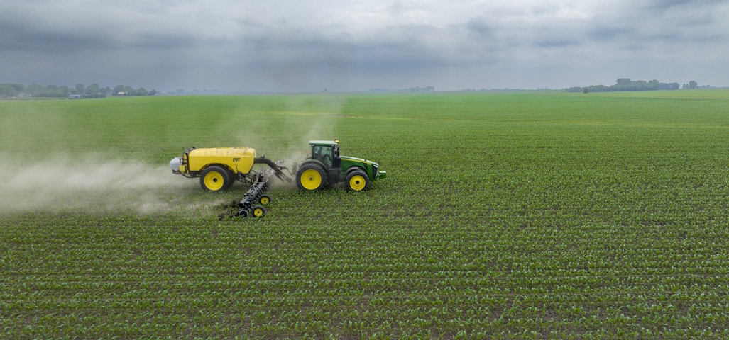 a few farm machines in a field