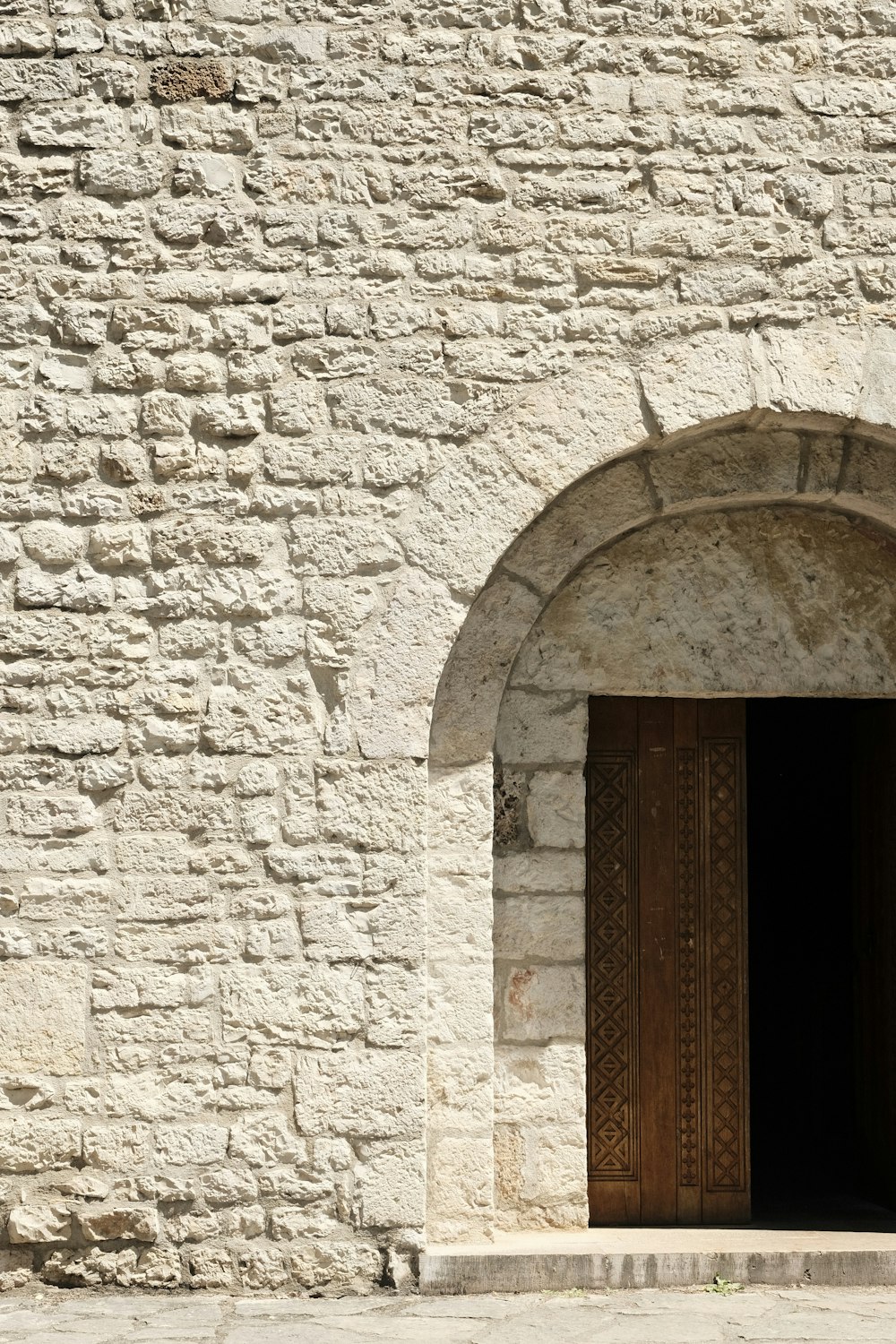 a stone wall with a door