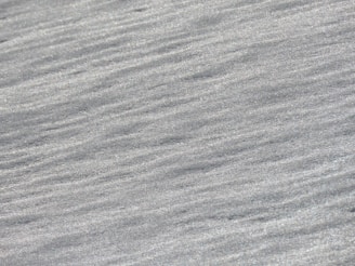 Brushed stainless steel sheet with a subtle, sophisticated finish.