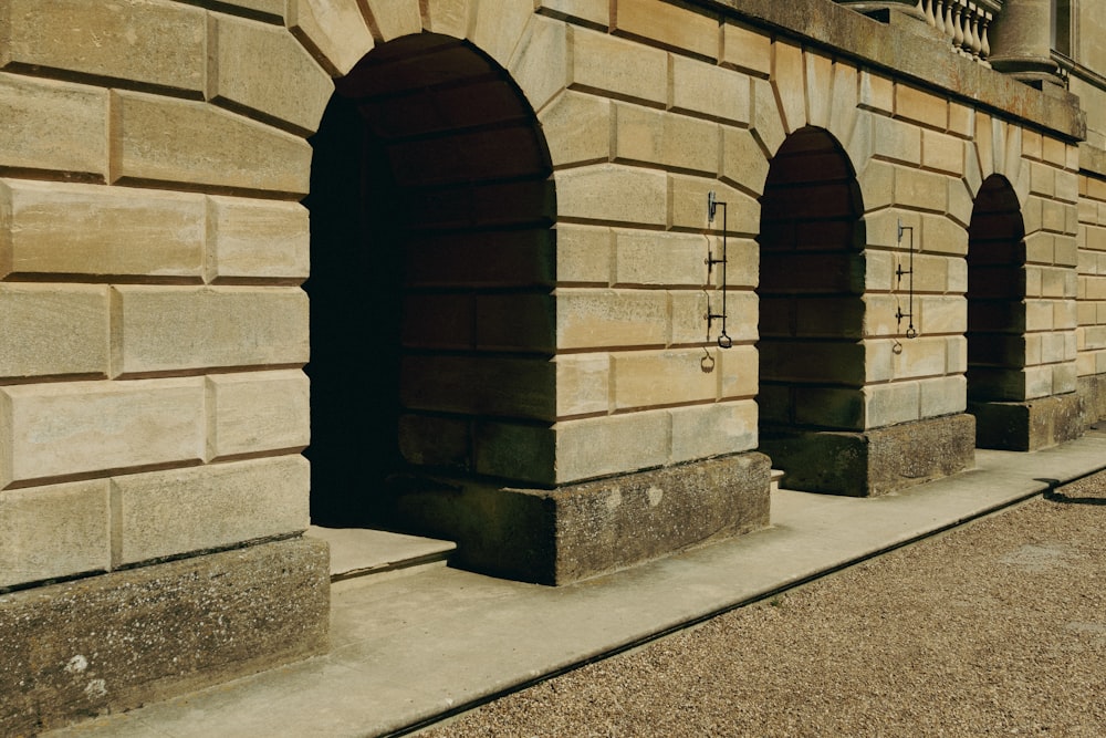 a stone wall with a stone walkway