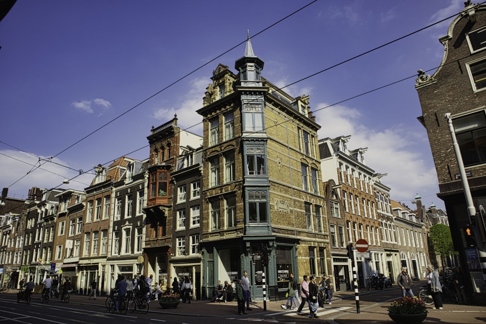 a group of people walking on a street in a city