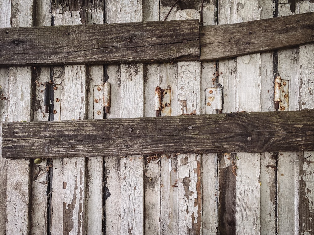 a wooden fence with a hole in it